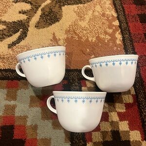 Set of three Corelle blue snowflake garland pattern teacup